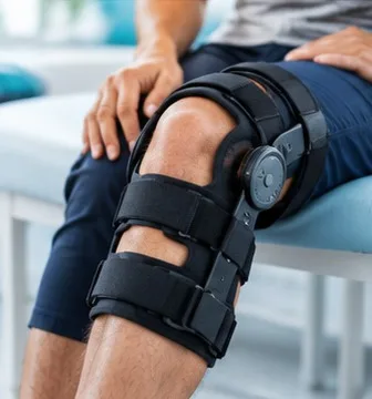 Knee supported by a post-operative brace